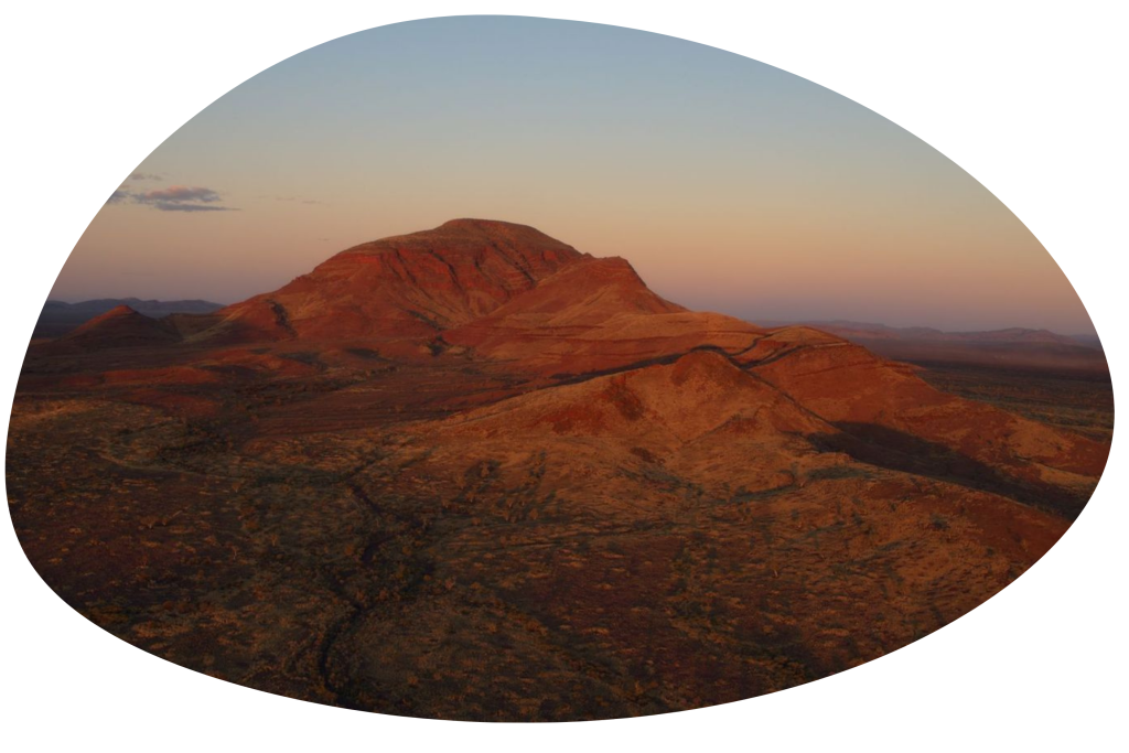 A red mountain at dusk from the documentary Yurlu | Country.